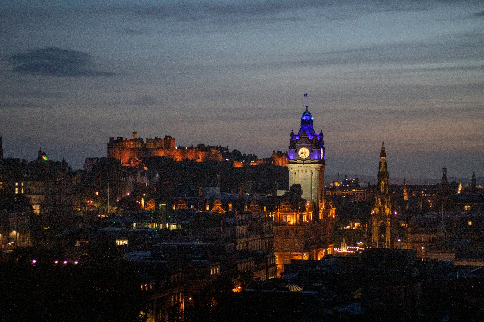 Edinburgh at dusk, with the castle and the Balmoral clock